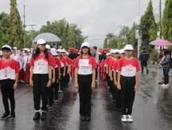 Semarak HUT ke-80 RI, Asisten III Adnan Masinae Lepas Peserta Lomba Gerak Jalan Tingkat SD se-Kotamobagu