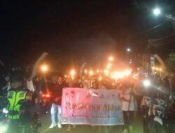 Babinsa Koramil 1303-03/Modayag Kawal 2.000 Warga dalam Pawai Obor Sambut Ramadhan 1447 H